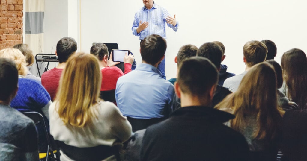 truck drivers in class learning about tire cost